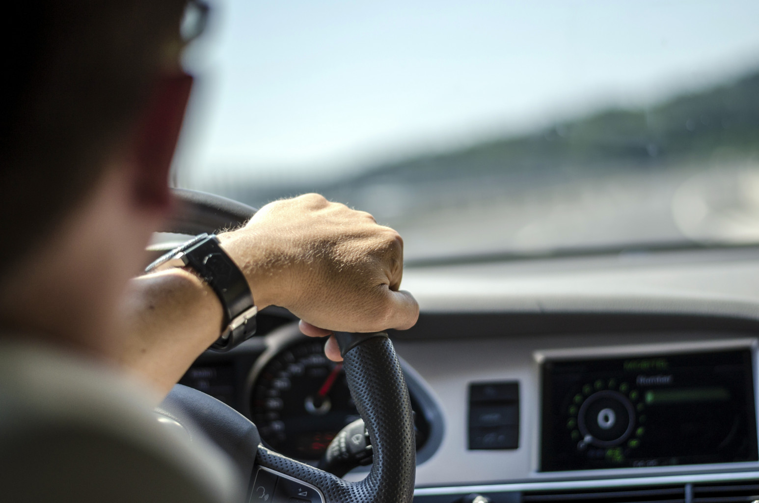 man driving car